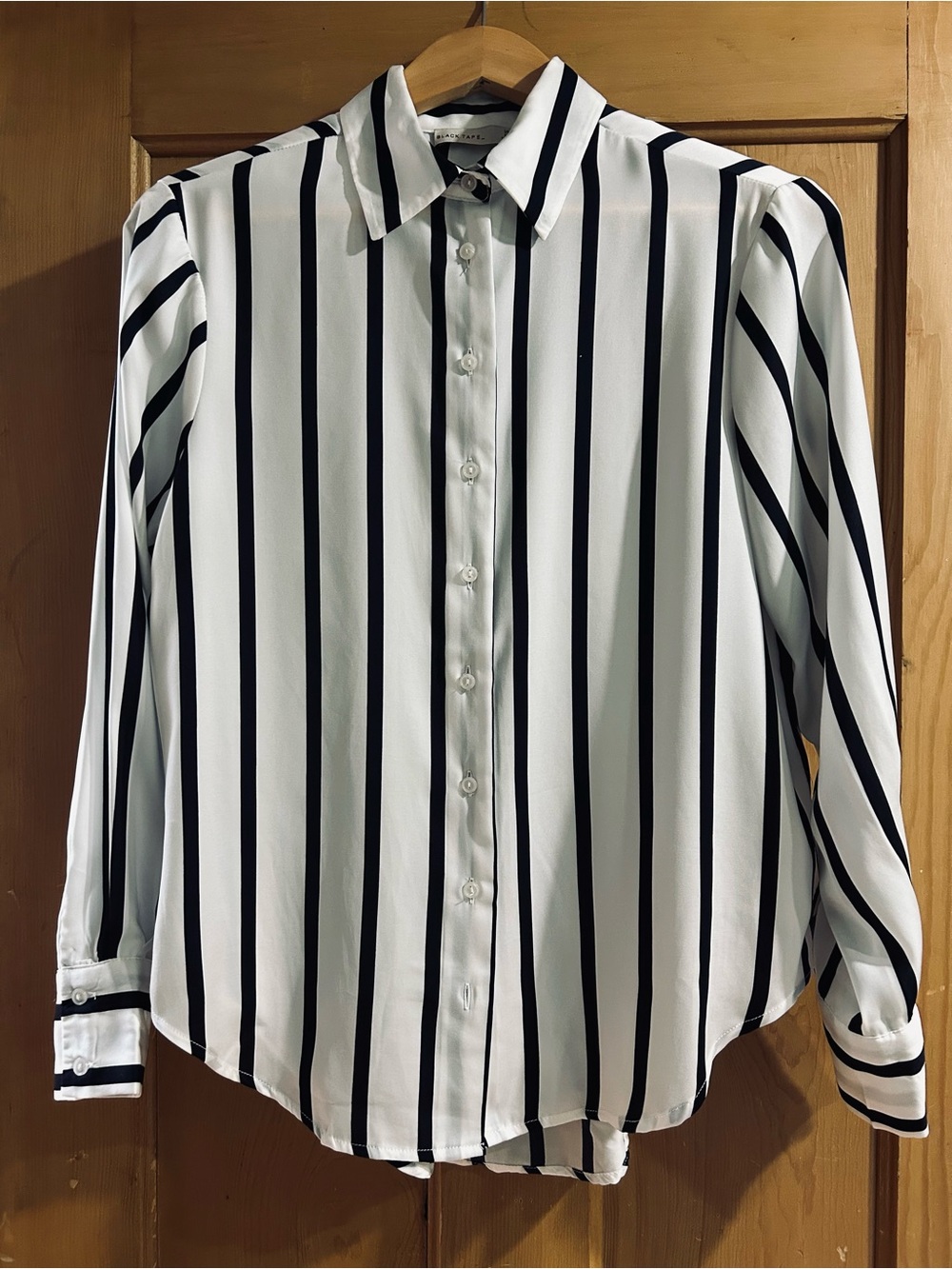 Black Tape_ White Blouse with Black Vertical Stripes